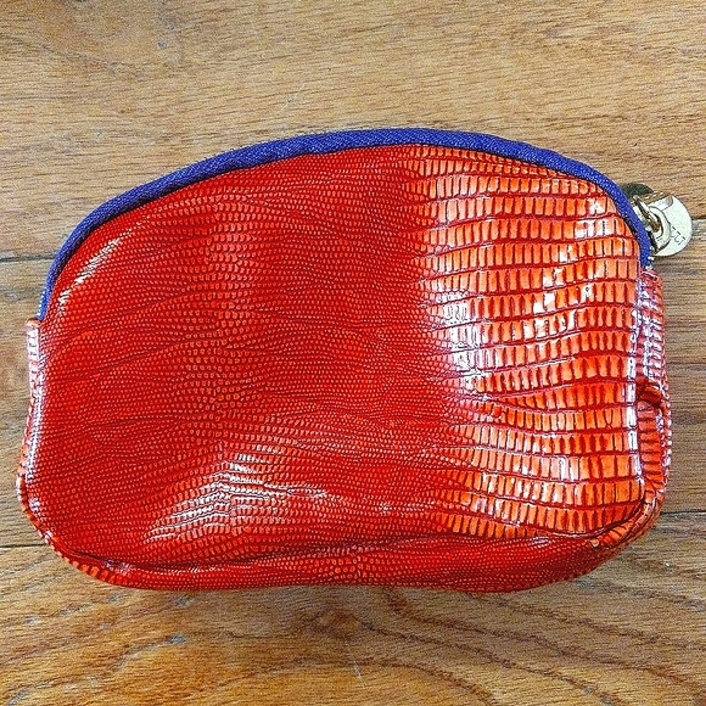Mark. Small bag with three zipper pockets orange
